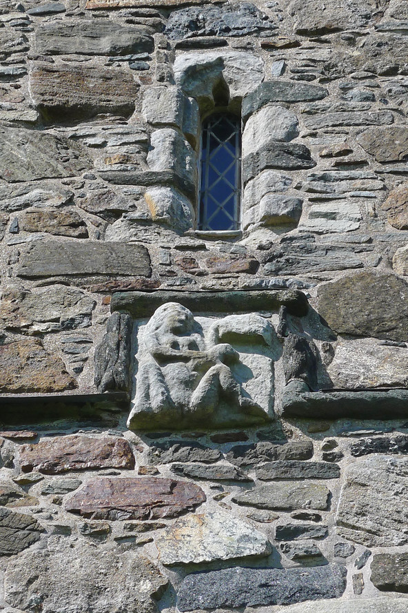 StClements_R0399.JPG - A Sheela Na Gig at the early 16th Century St. Clements church built by the McLeods. This and other carved stones used in the St Clements church are from a far older structure and are pre-Christian in origin. Sheelas are Pagan fertility symbols but their exact meaning is unknown. 