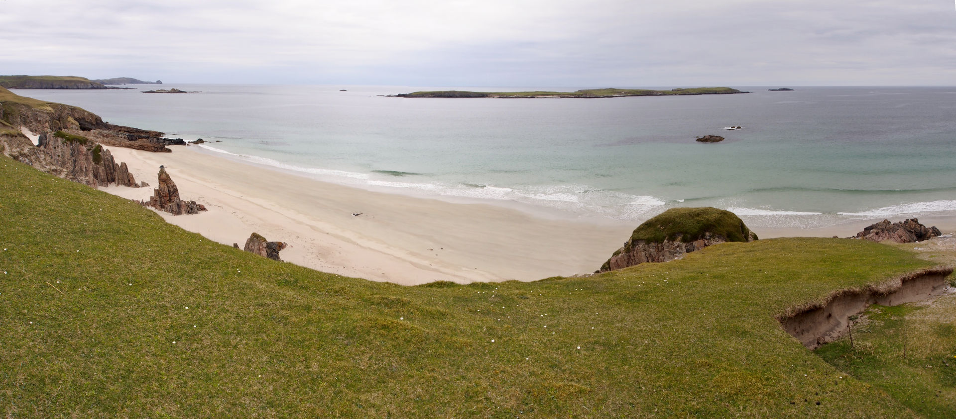 EileanHoan_0717-19.jpg - Eilean Hoan from the beach at Traigh allt Cheilgeag. Near Sangobeg. There are remains of a Clearance Village here. The Highland Clearances occurred in the 18th and  19th Century and were largely carried out by absentee hereditary aristocratic landowners who evicted tenant farmers by force in order to convert their land to more profitable sheep grazing. The resulting destruction of both landscape and culture is still being felt today.